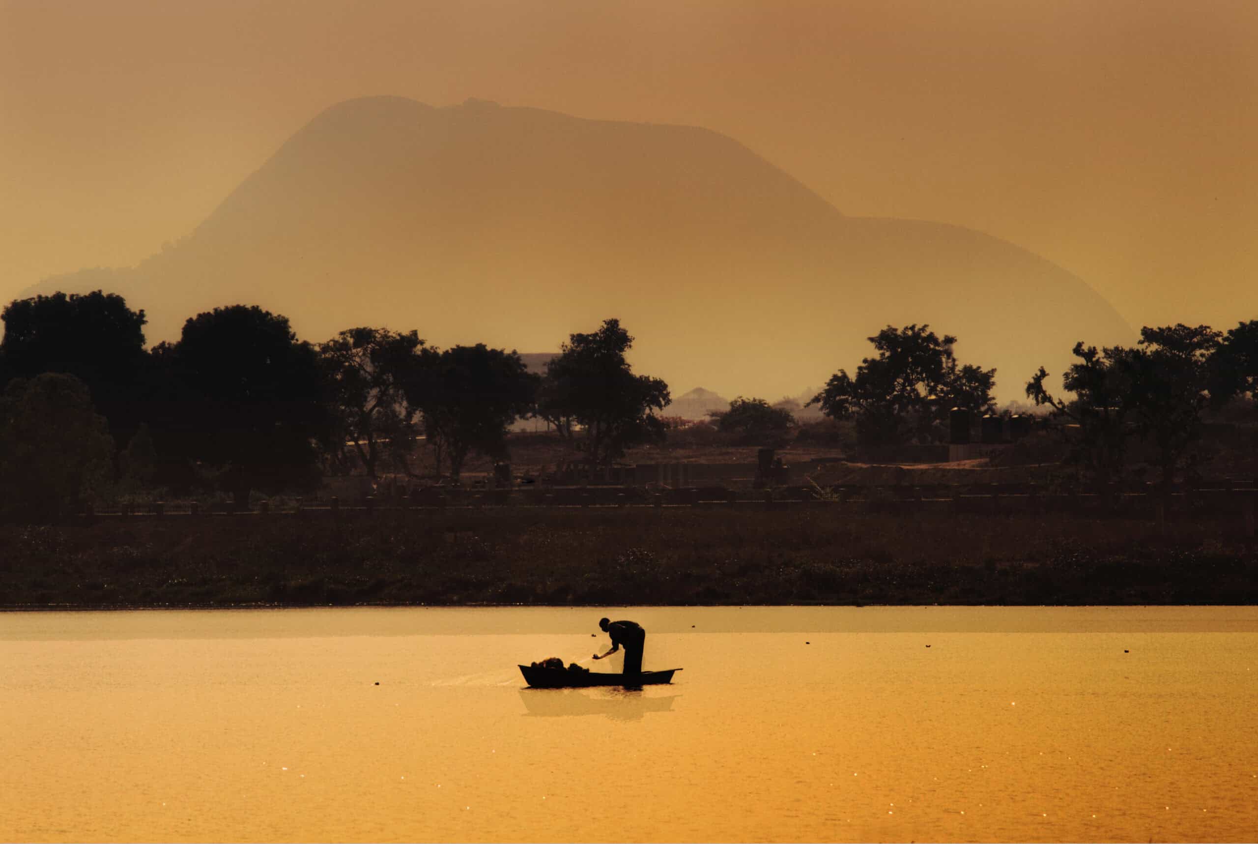 Silhouetted fisherman in Nigeria