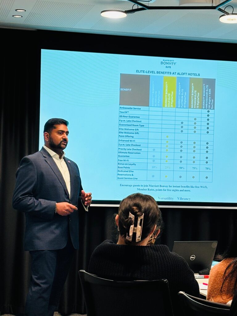 A Marriott Assistant Manager of Rooms conducting a presentation