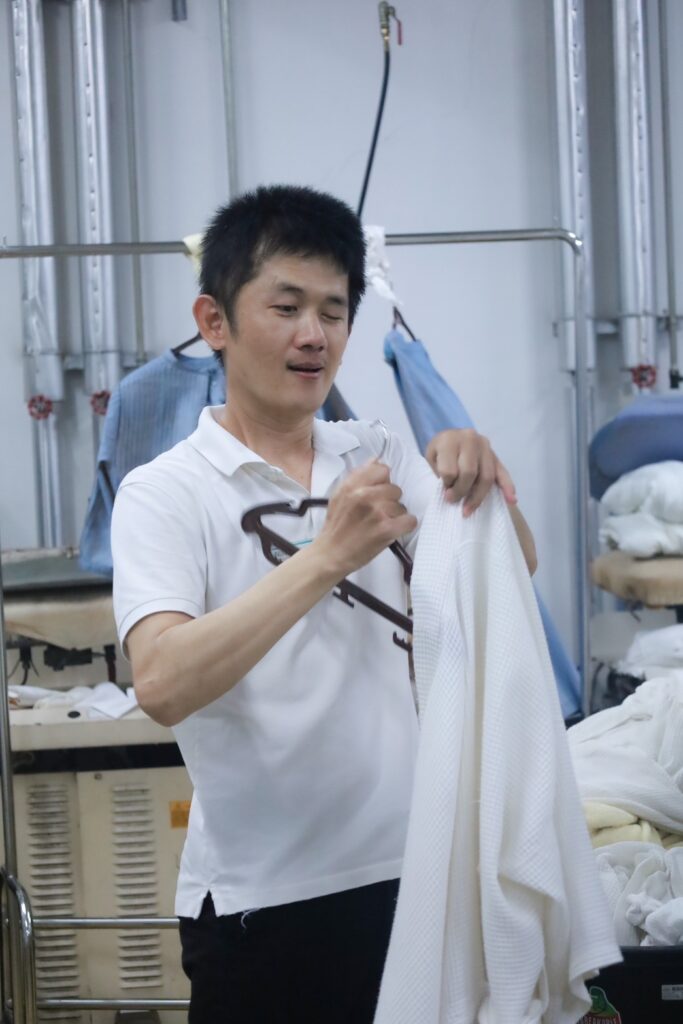 A PWD Marriott associate at work in the laundry room.