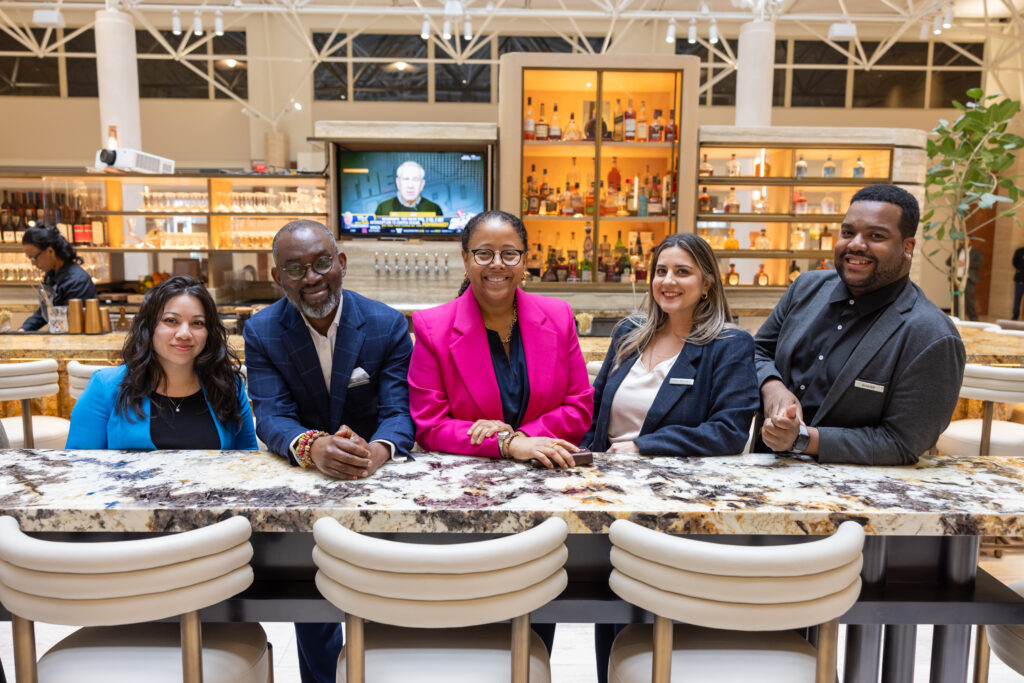 Marriott associates stand together at a table 